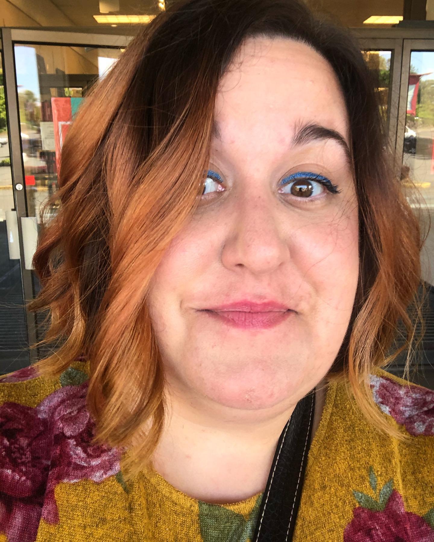 Deep side-parted bob with dark roots and curved copper-toned ends