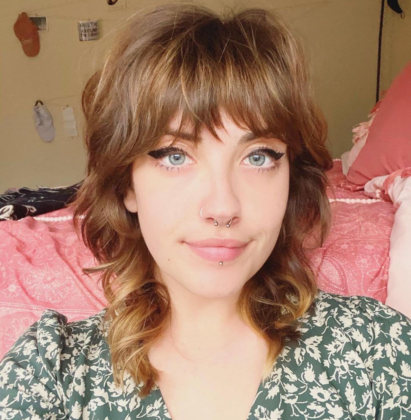 Shoulder-length layered shag with soft fringe and curled ends