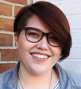 Deep side-parted pixie bob with a sweeping fringe and tapered back