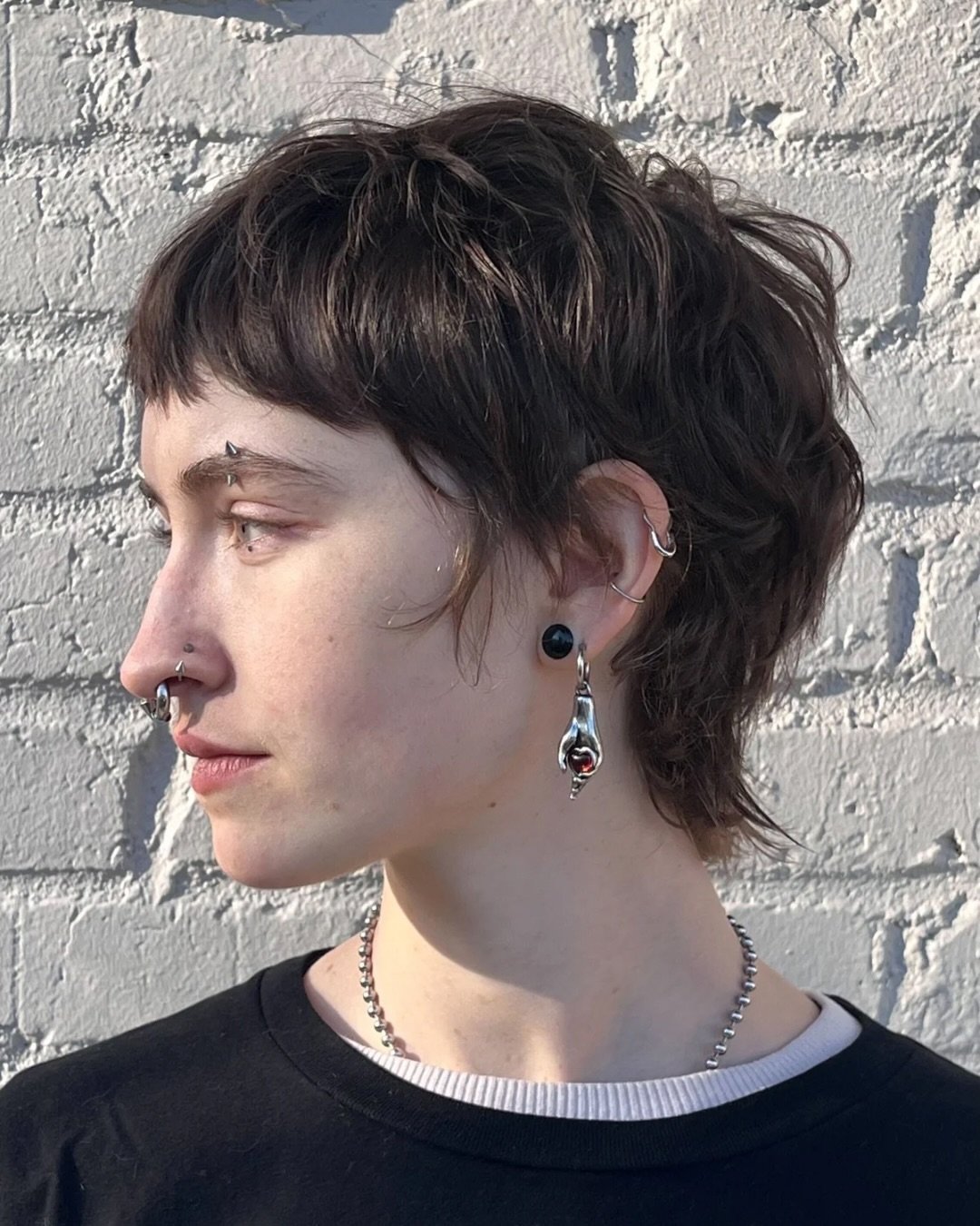 Textured pixie shag with a micro fringe and feathered nape