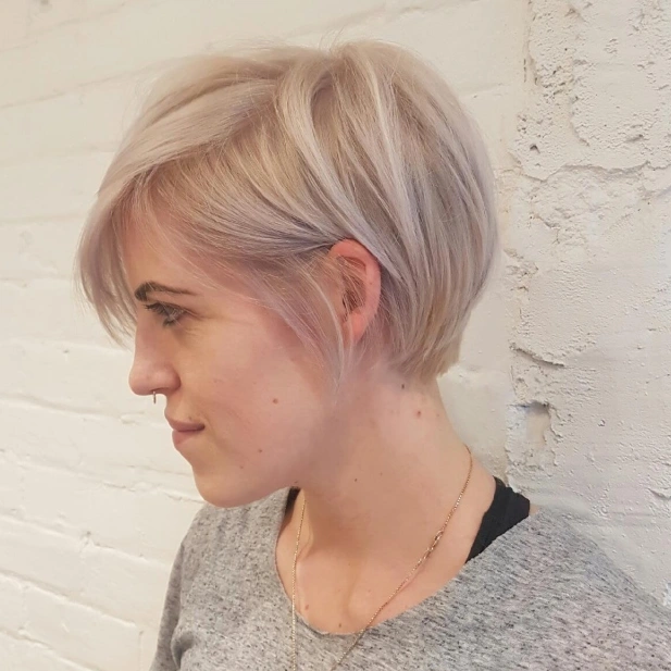 Pale lavender asymmetrical pixie bob with a long side fringe