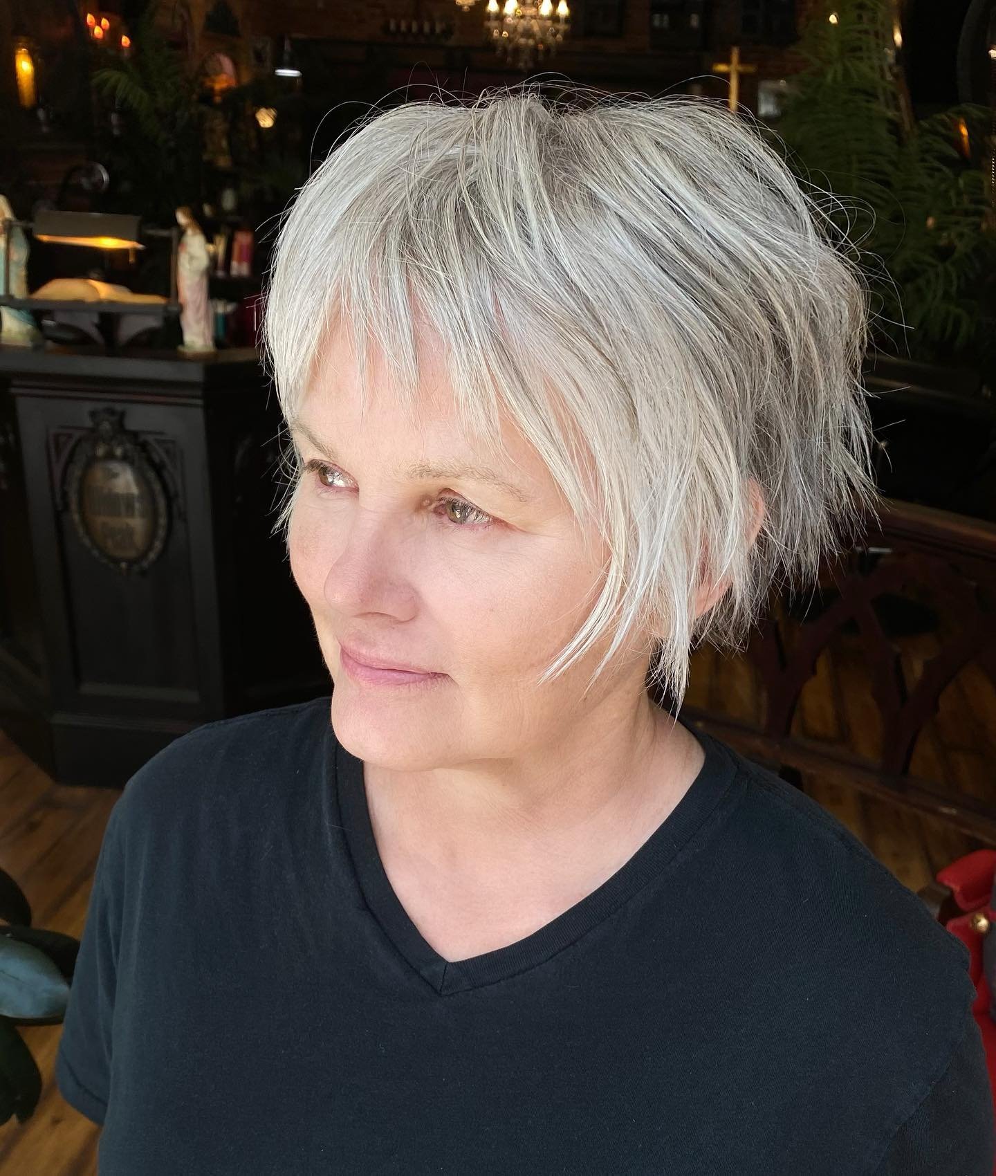 Tousled silver pixie bob with wispy fringe and layered sides