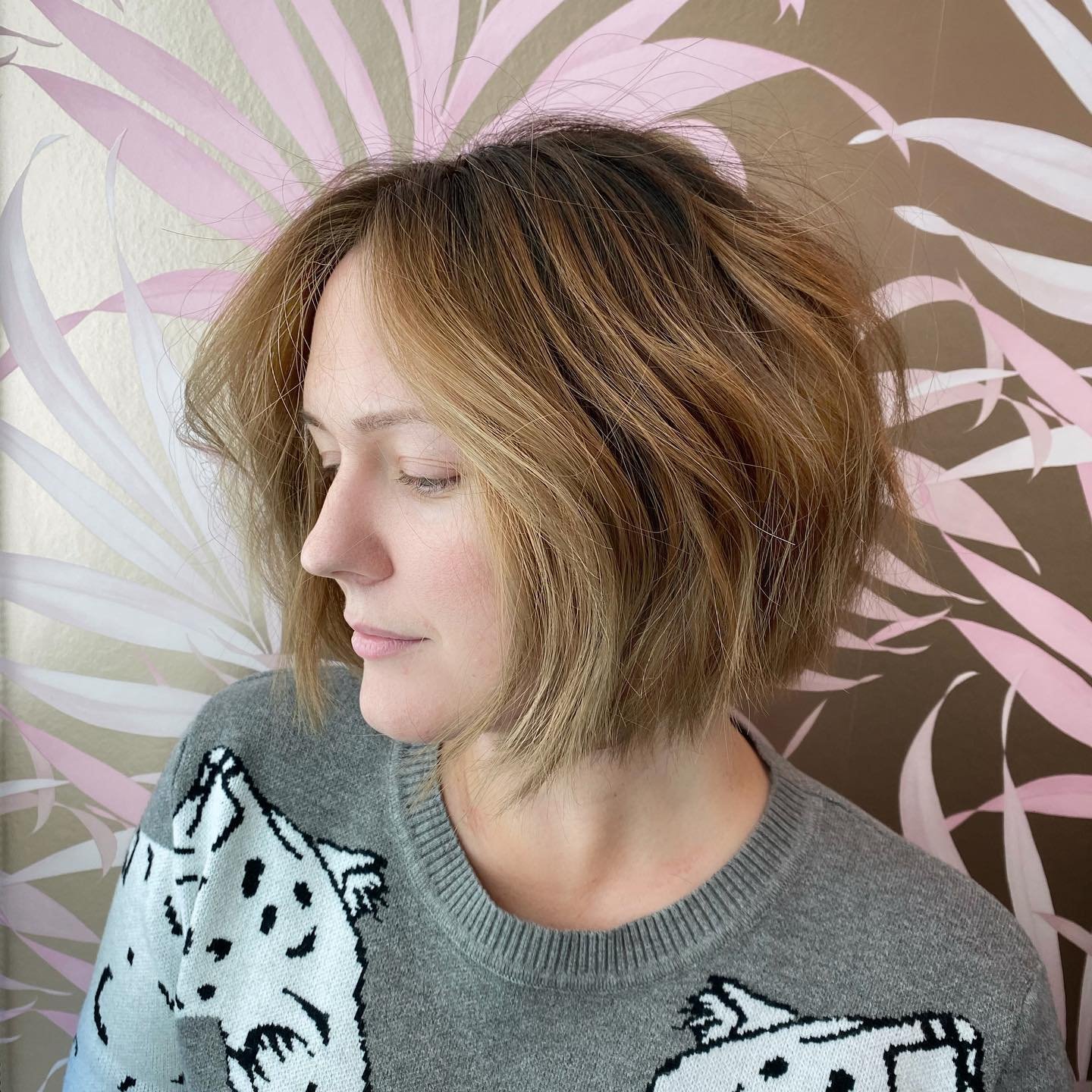 Choppy chin-length bob with tousled layers and root lift