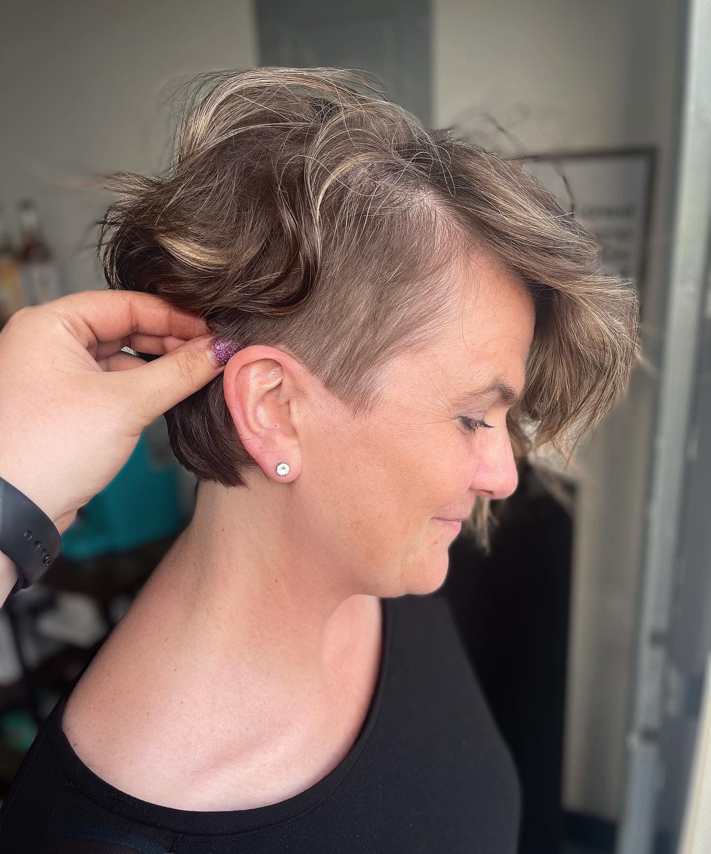 Undercut pixie with a voluminous side-swept top
