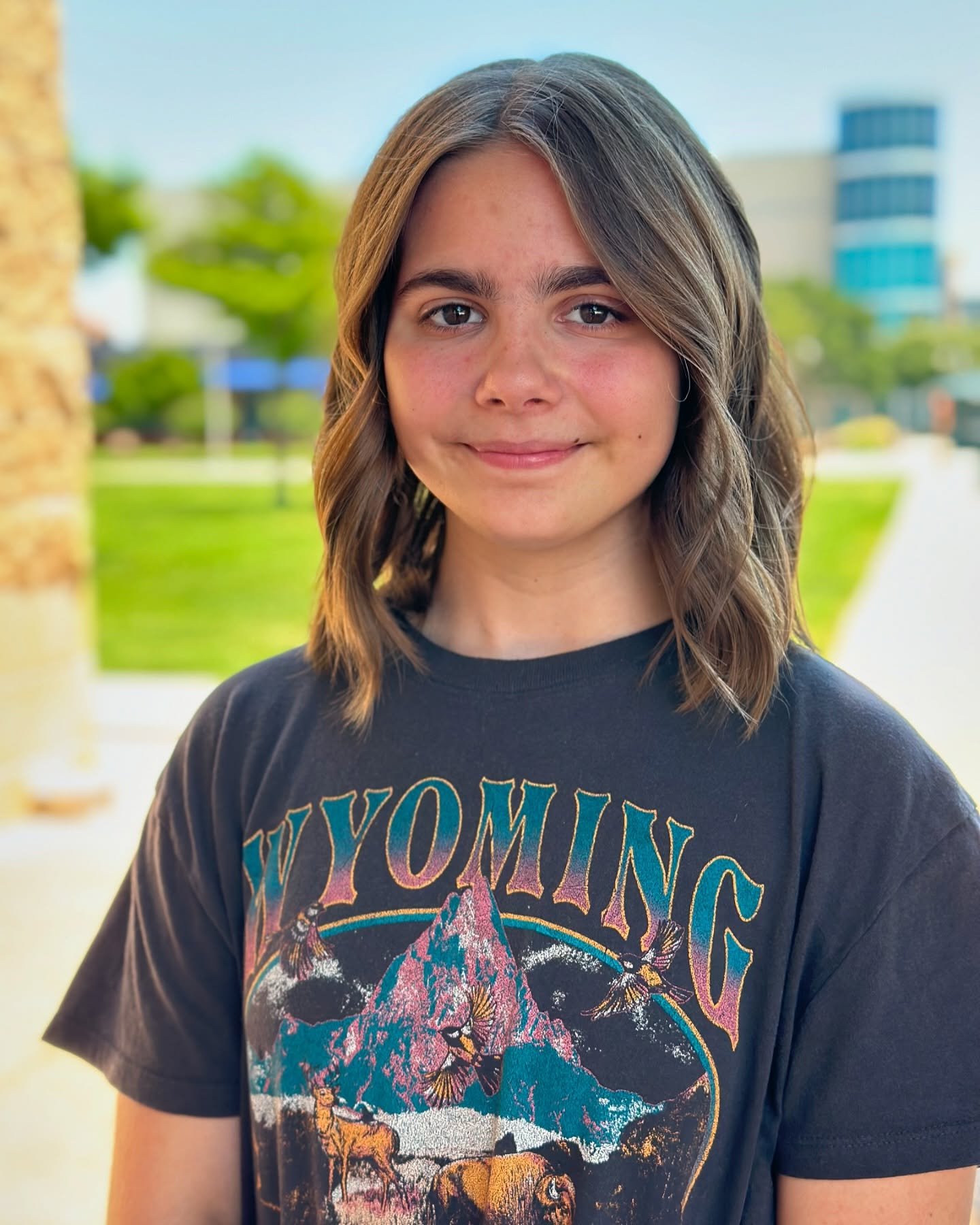 Centre-parted shoulder-length lob with loose waves