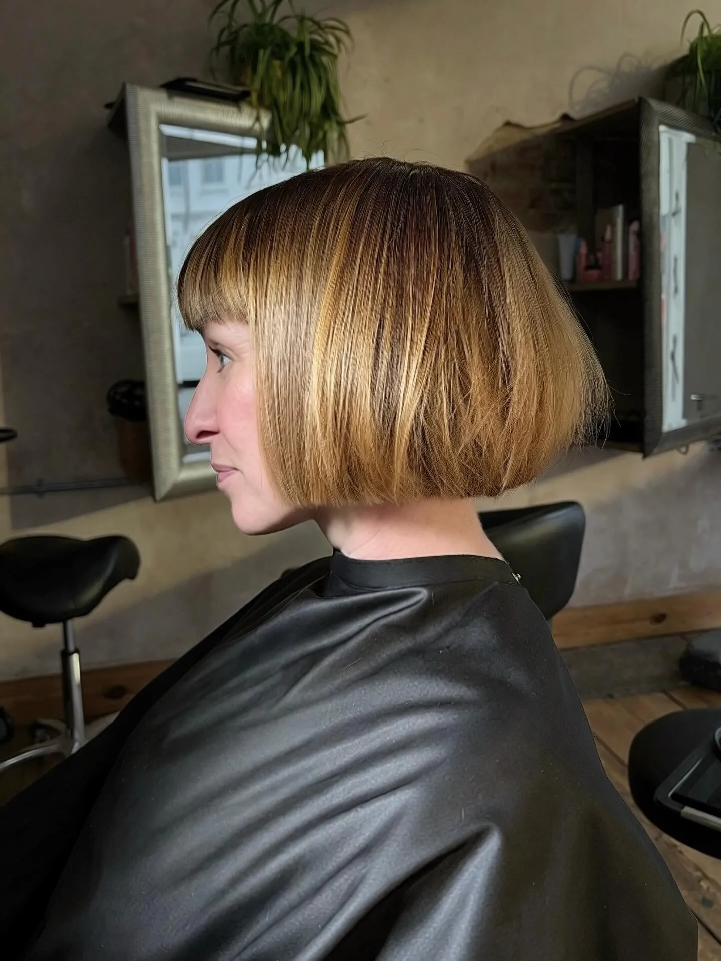 rounded chin-length bob with blunt fringe and softly graduated ends