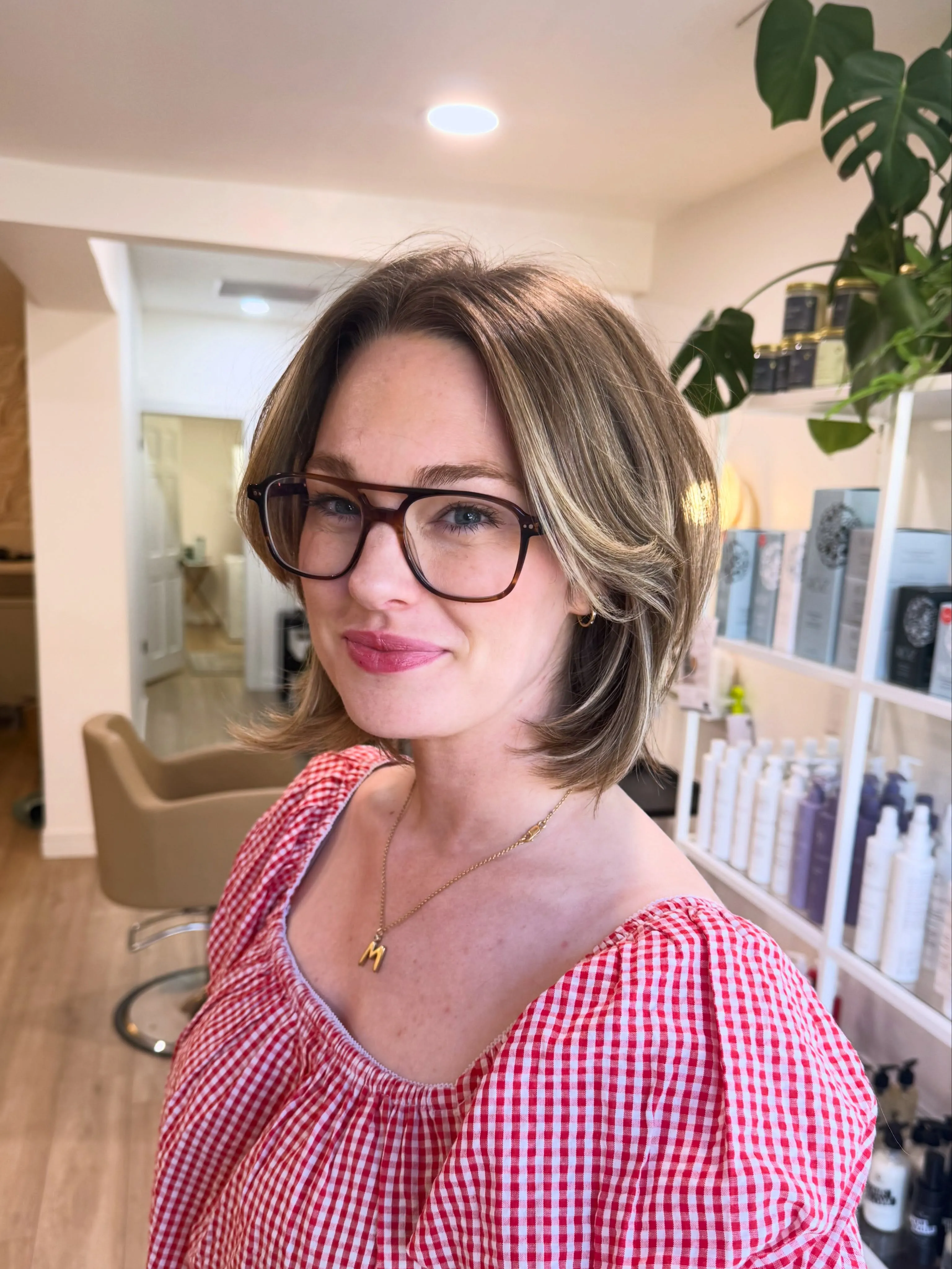 layered brunette bob with face-framing highlights and soft curtain fringe