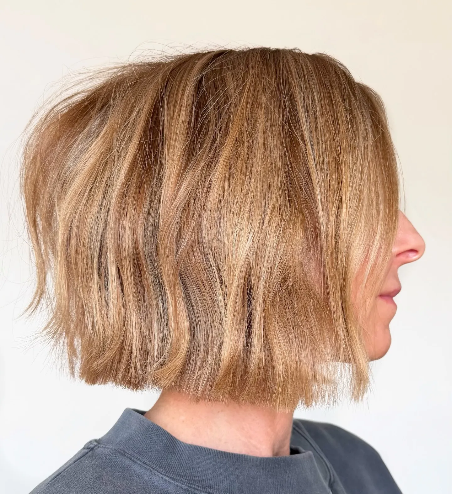 blunt light brown bob with natural waves and softly textured ends