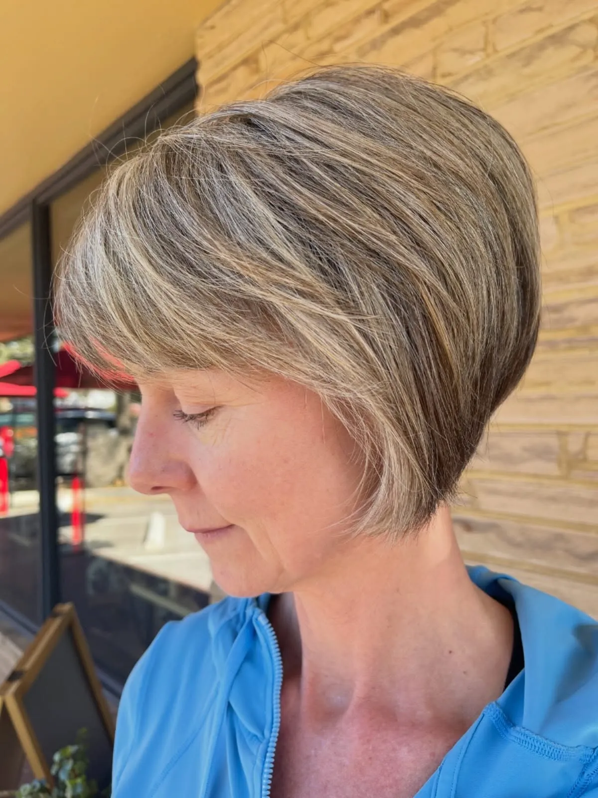 layered grey pixie bob with side-swept fringe and tapered nape