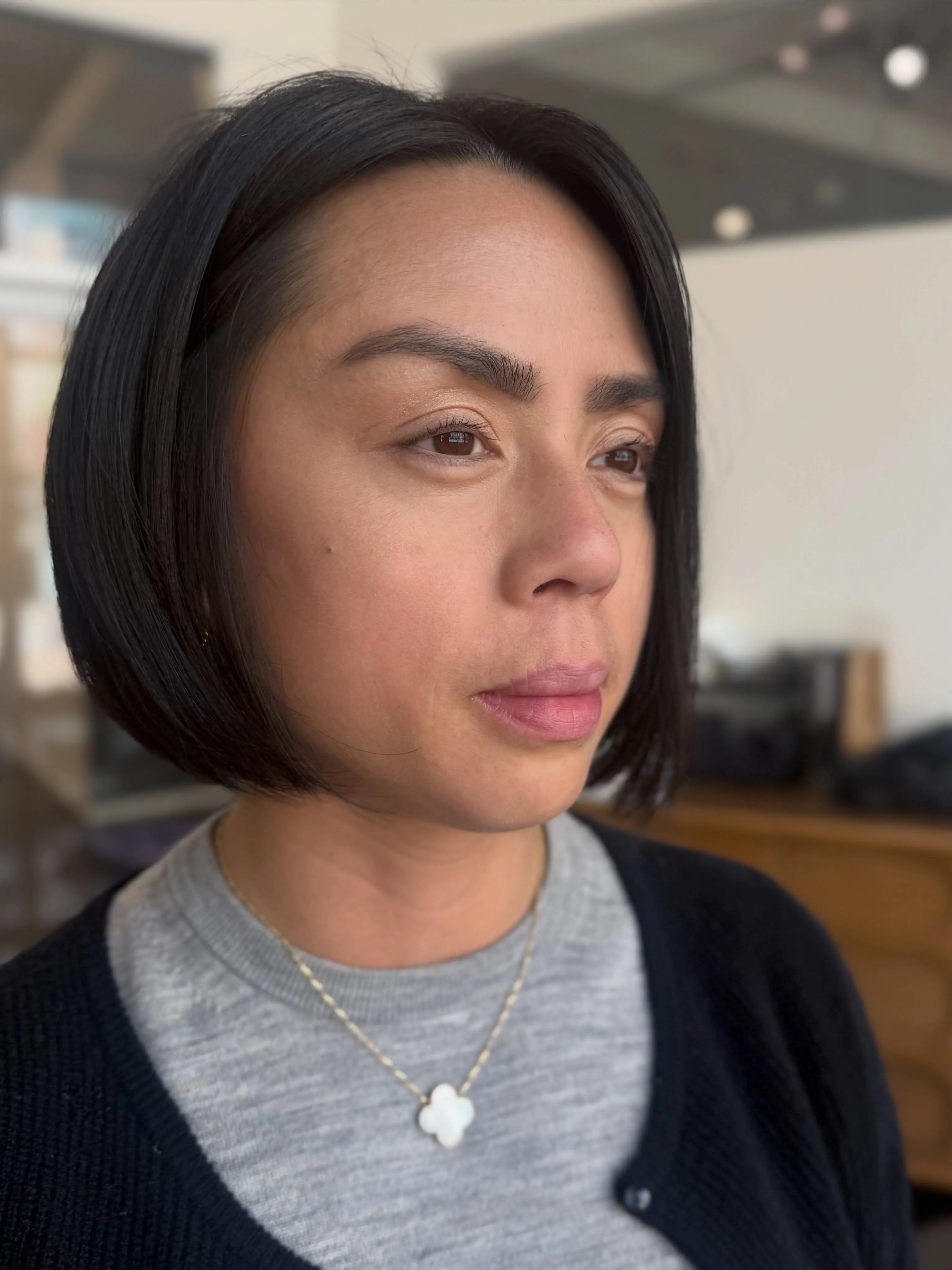 sleek black angled bob with long front and shorter rounded back