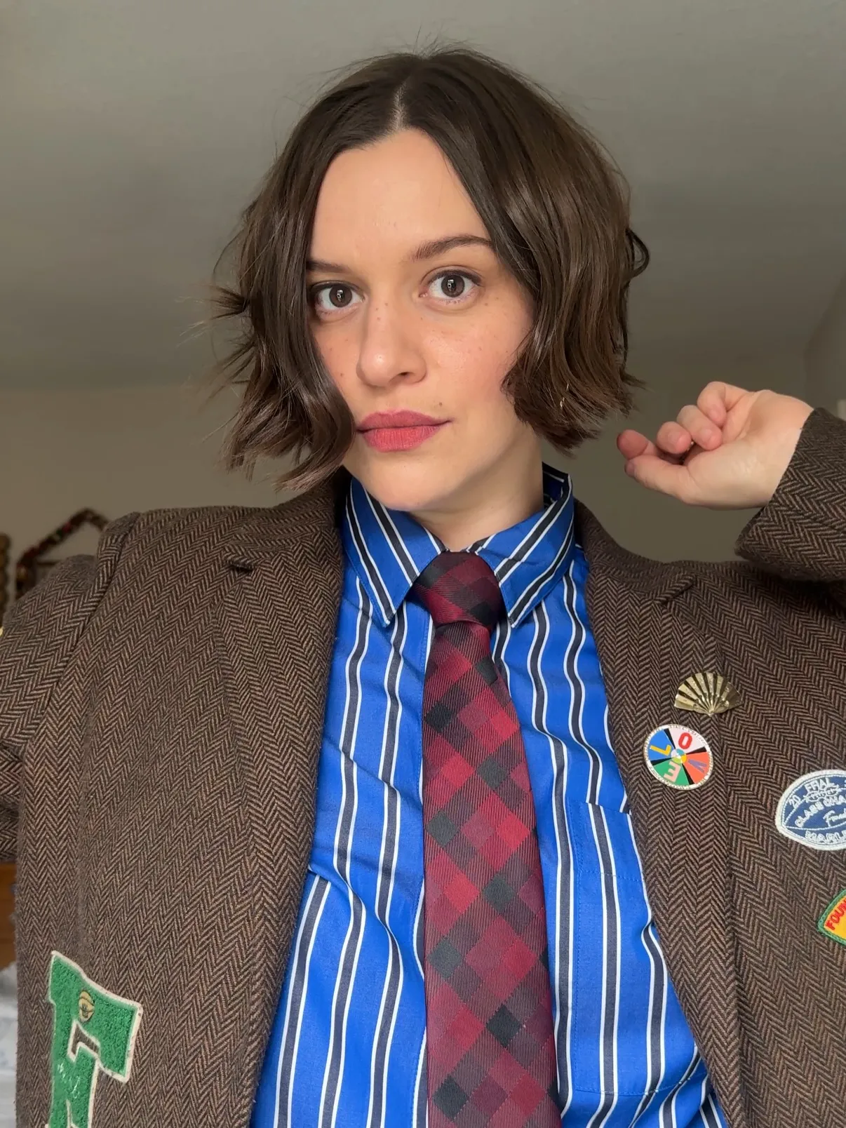 wavy dark chin-length bob with centre part and flicked ends
