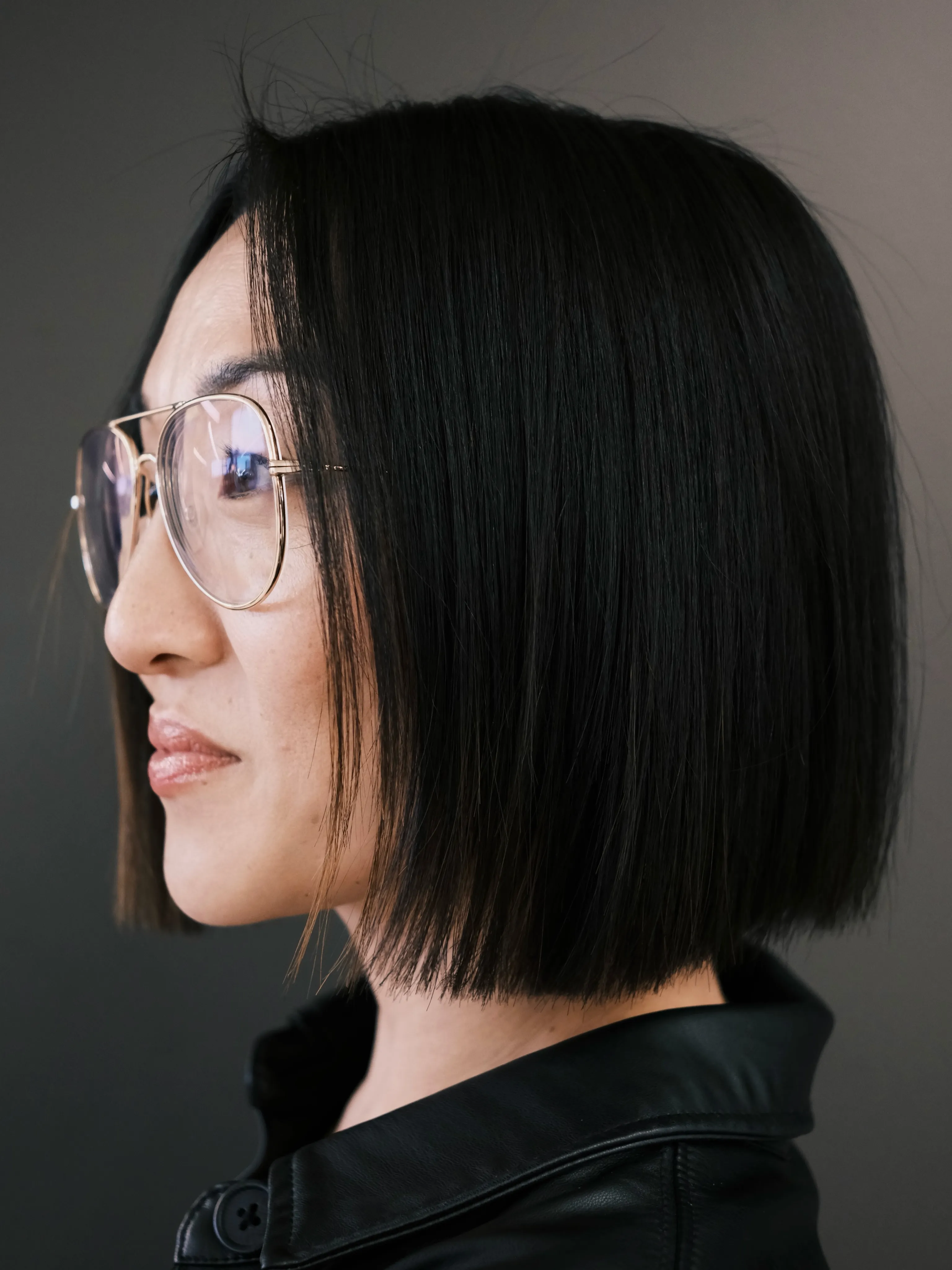 precision black blunt bob with clean centre part and straight jaw-length edge