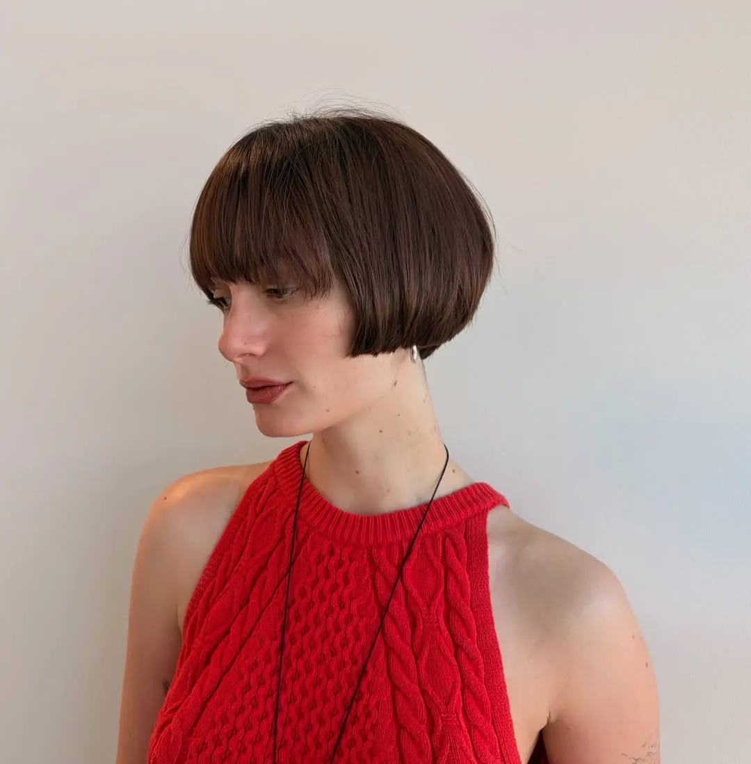 rounded short brown bob with long full fringe and tapered nape