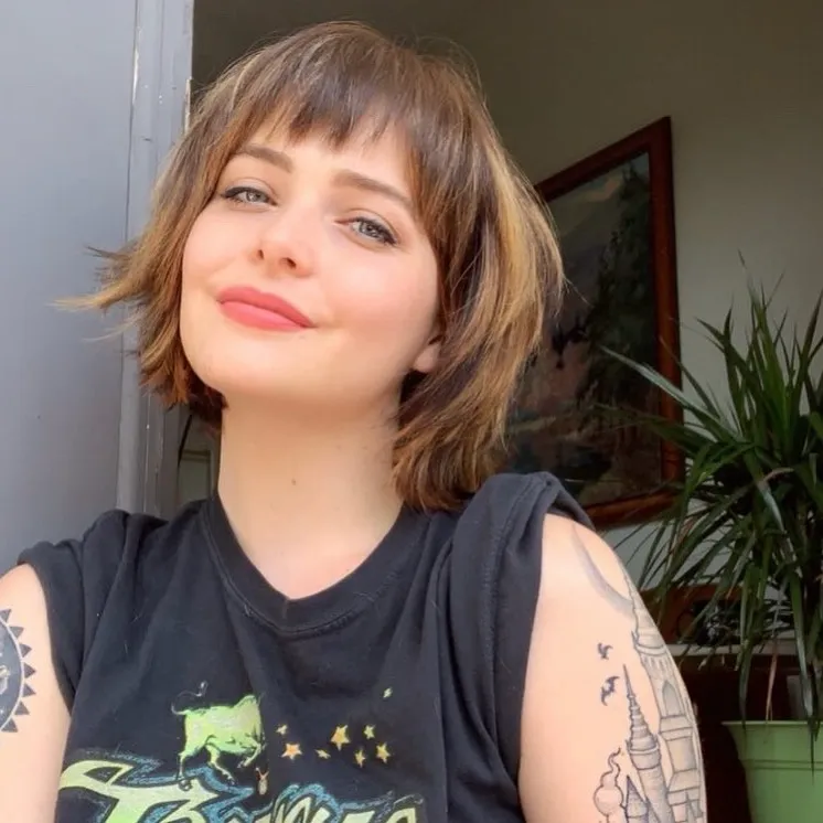 shaggy brown bob with short wispy fringe and flicked layers