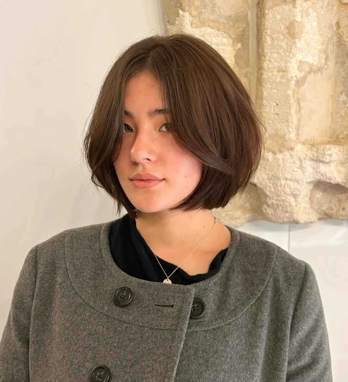 soft rounded brown bob with long curtain fringe and tucked ends