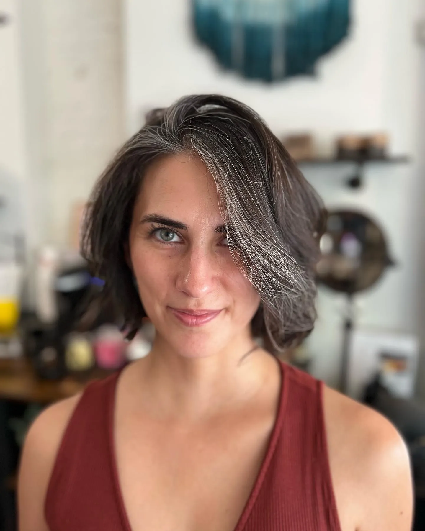 asymmetrical silver and dark bob with deep side part and sweeping front