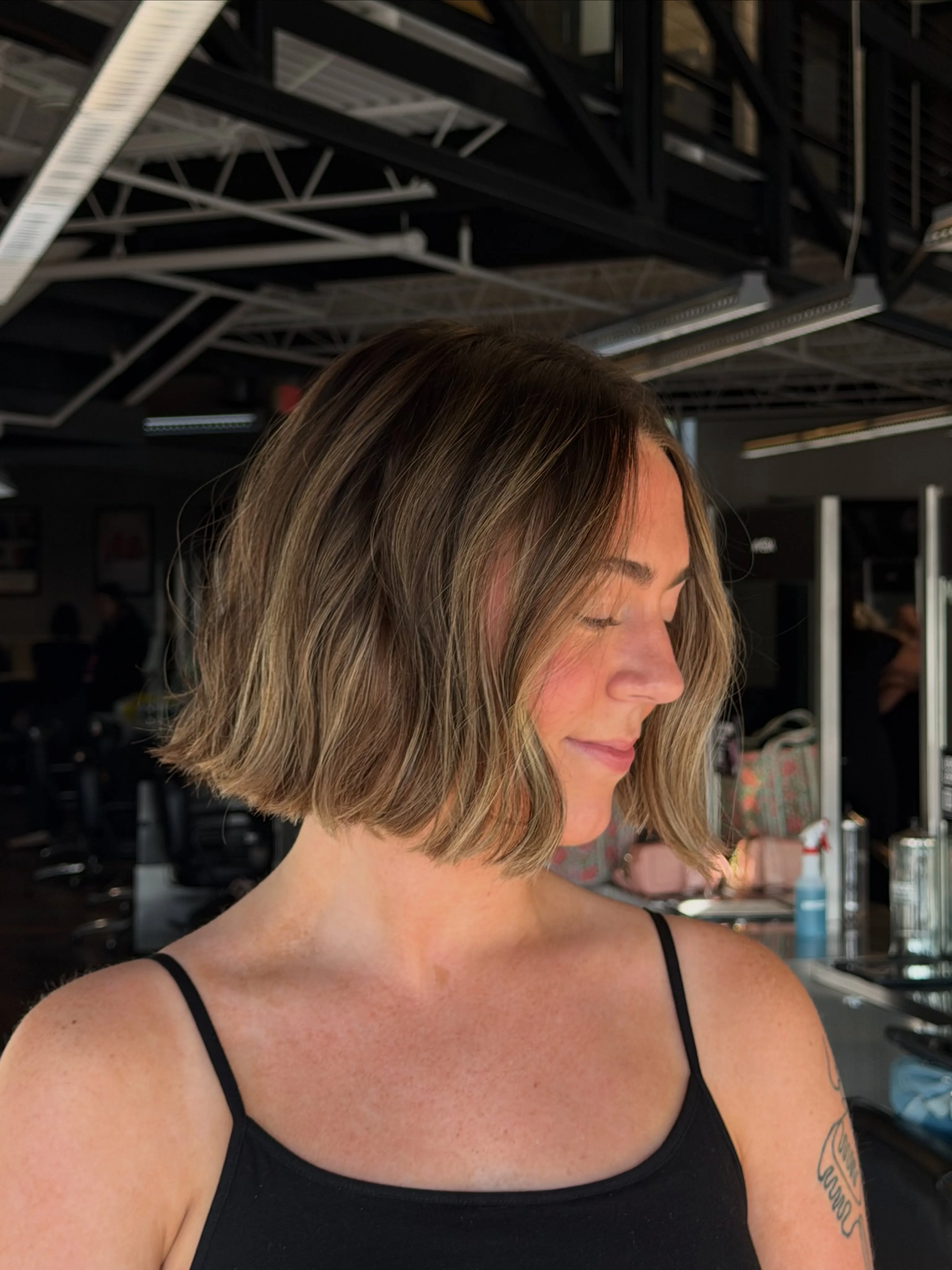 blunt wavy bob with face-framing highlights and soft side part