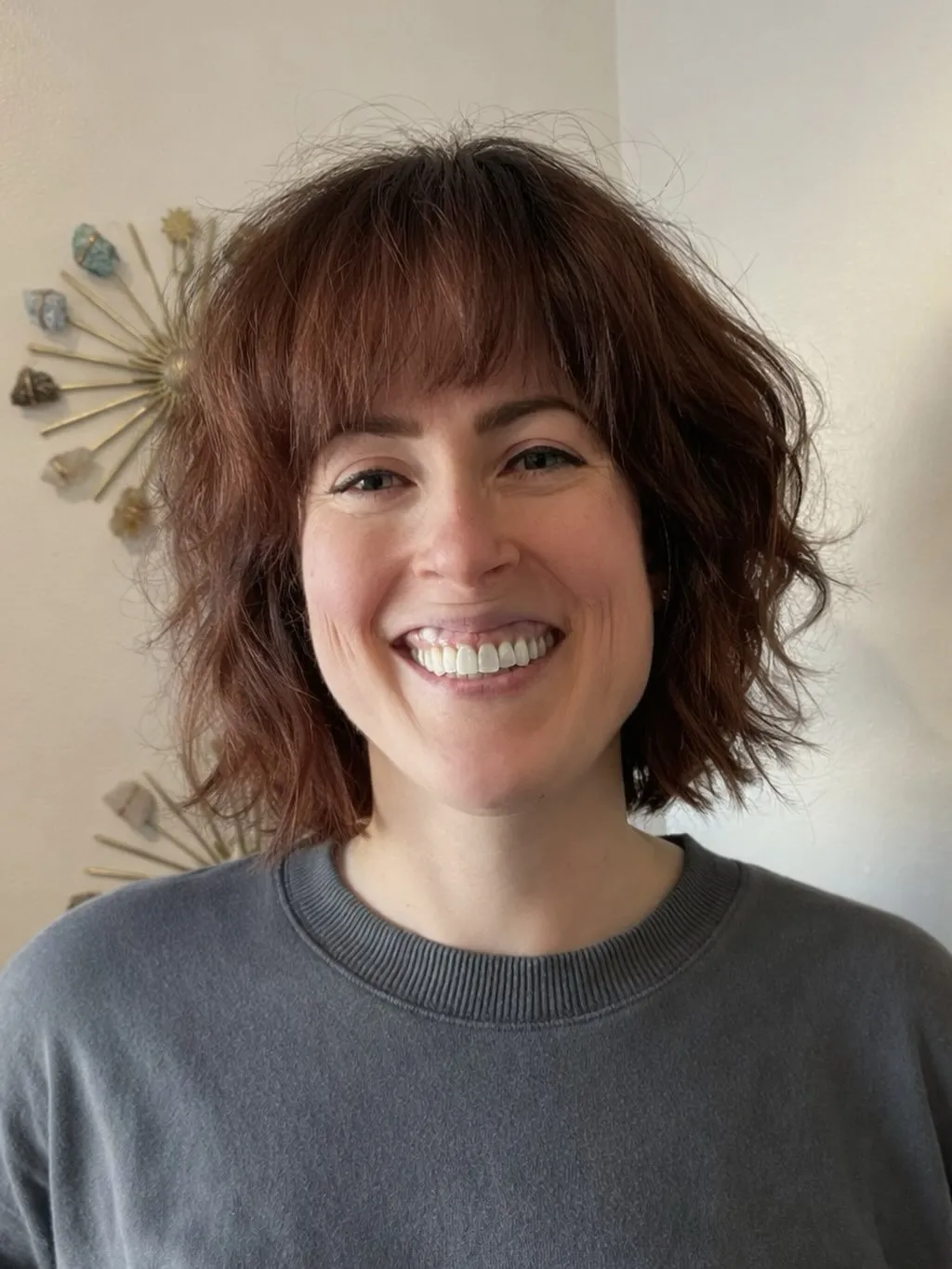 shaggy curly bob with rounded fringe and layered ends