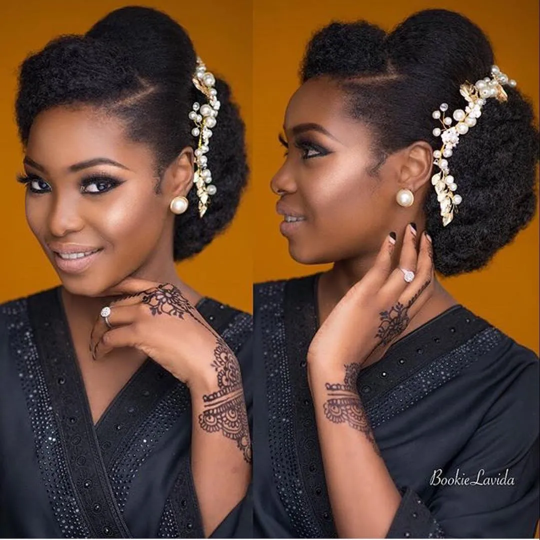 Side-swept bridal puff with sculpted front section and pearl leaf hair vine