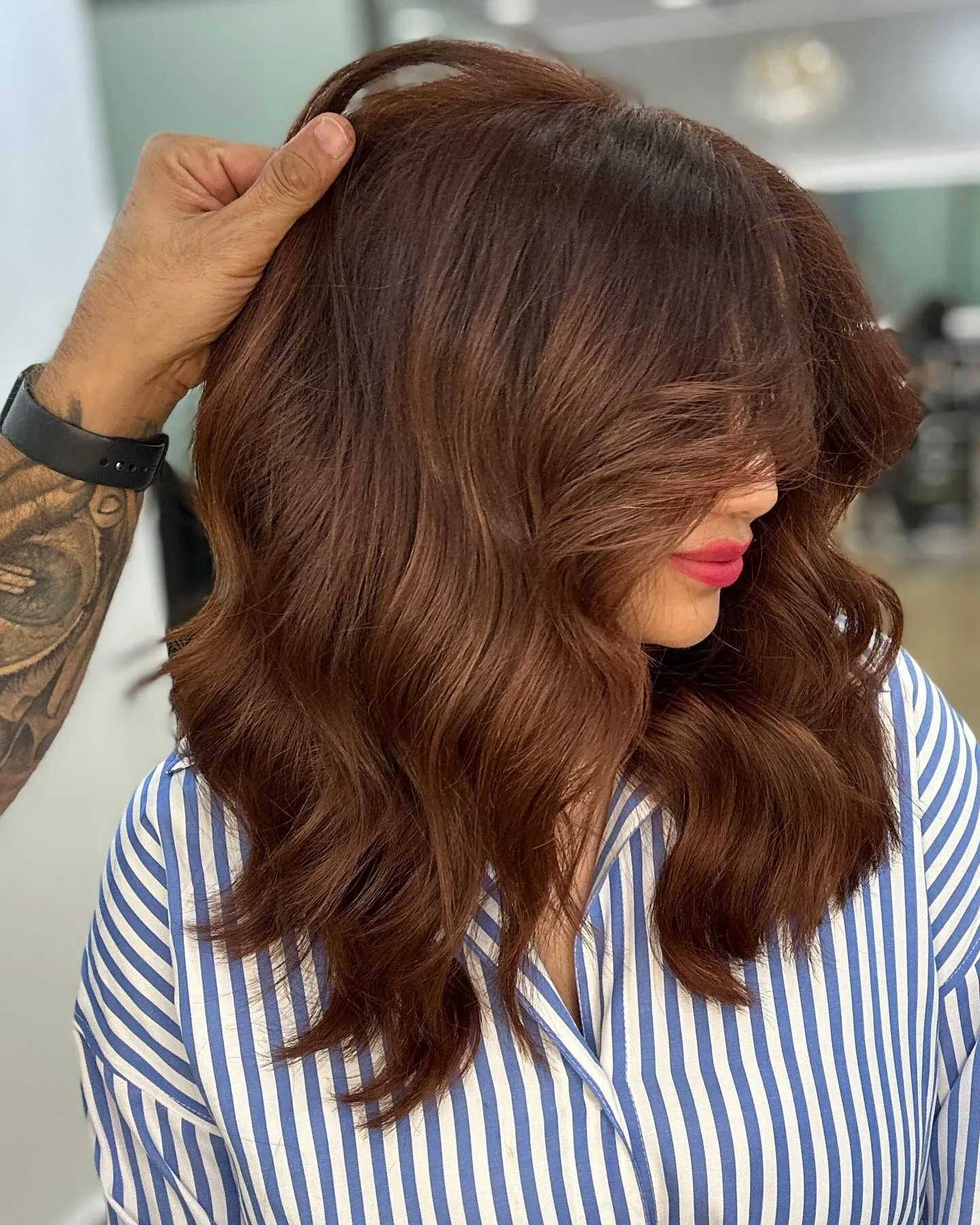 Deep amber brown hair with voluminous side-swept waves