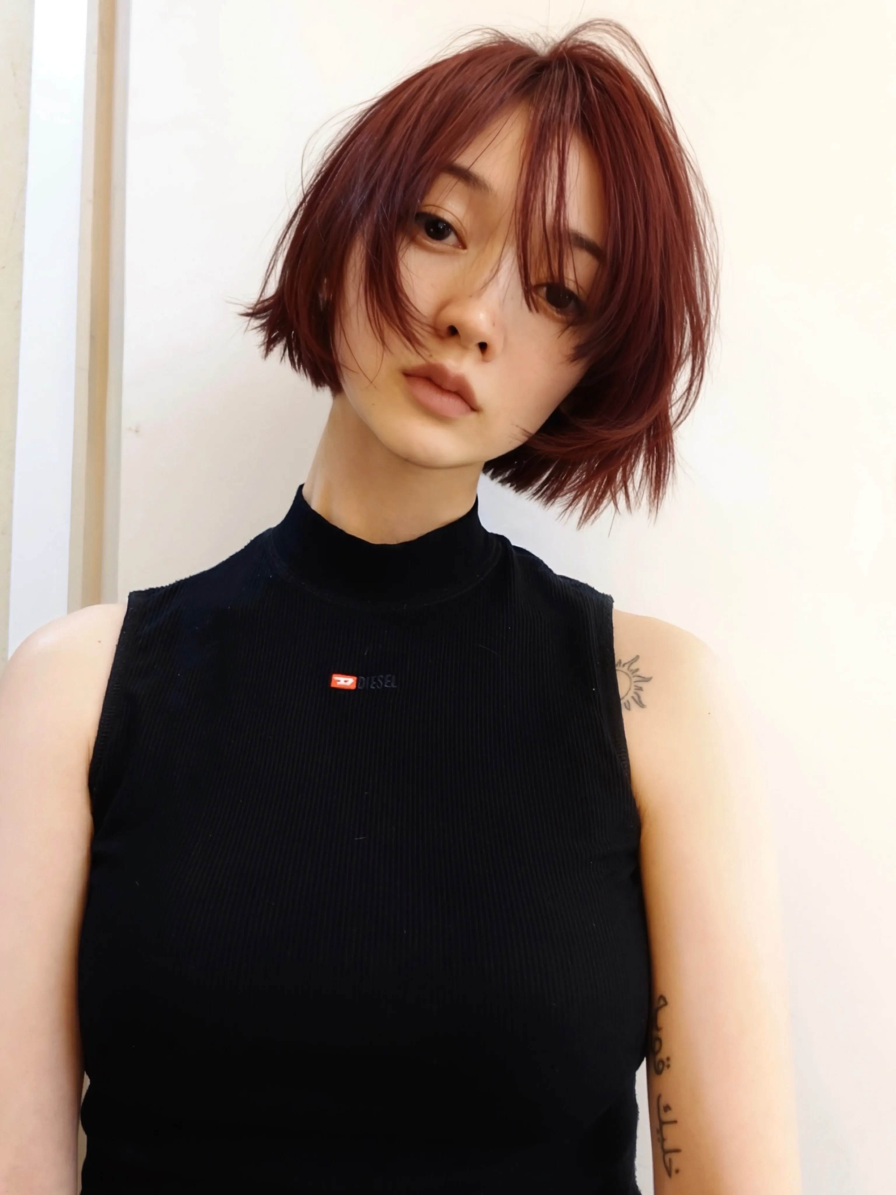 Short auburn bob with wispy face-framing pieces