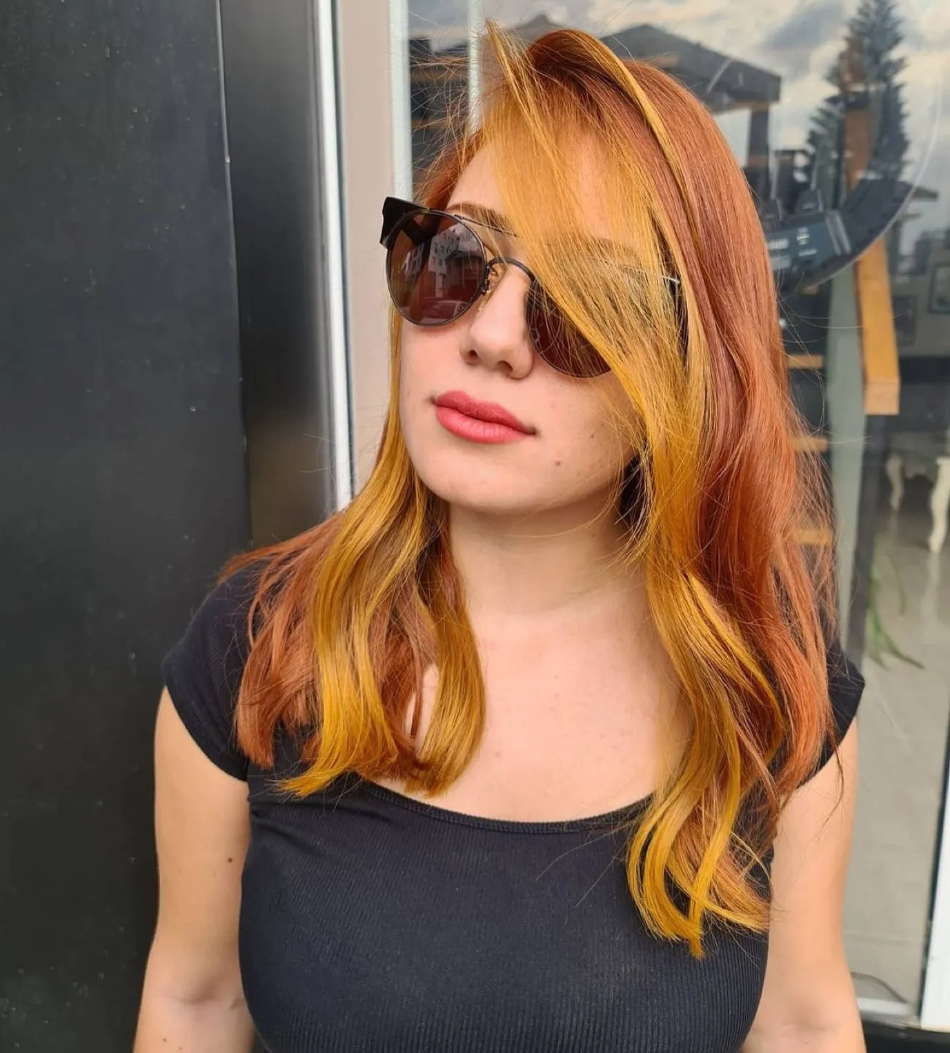 Two-tone amber and golden hair with long face-framing pieces