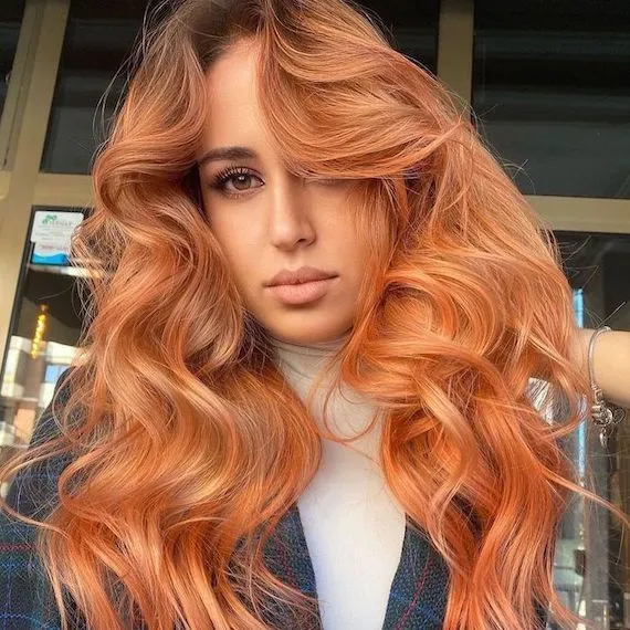 Long light copper hair with voluminous waves