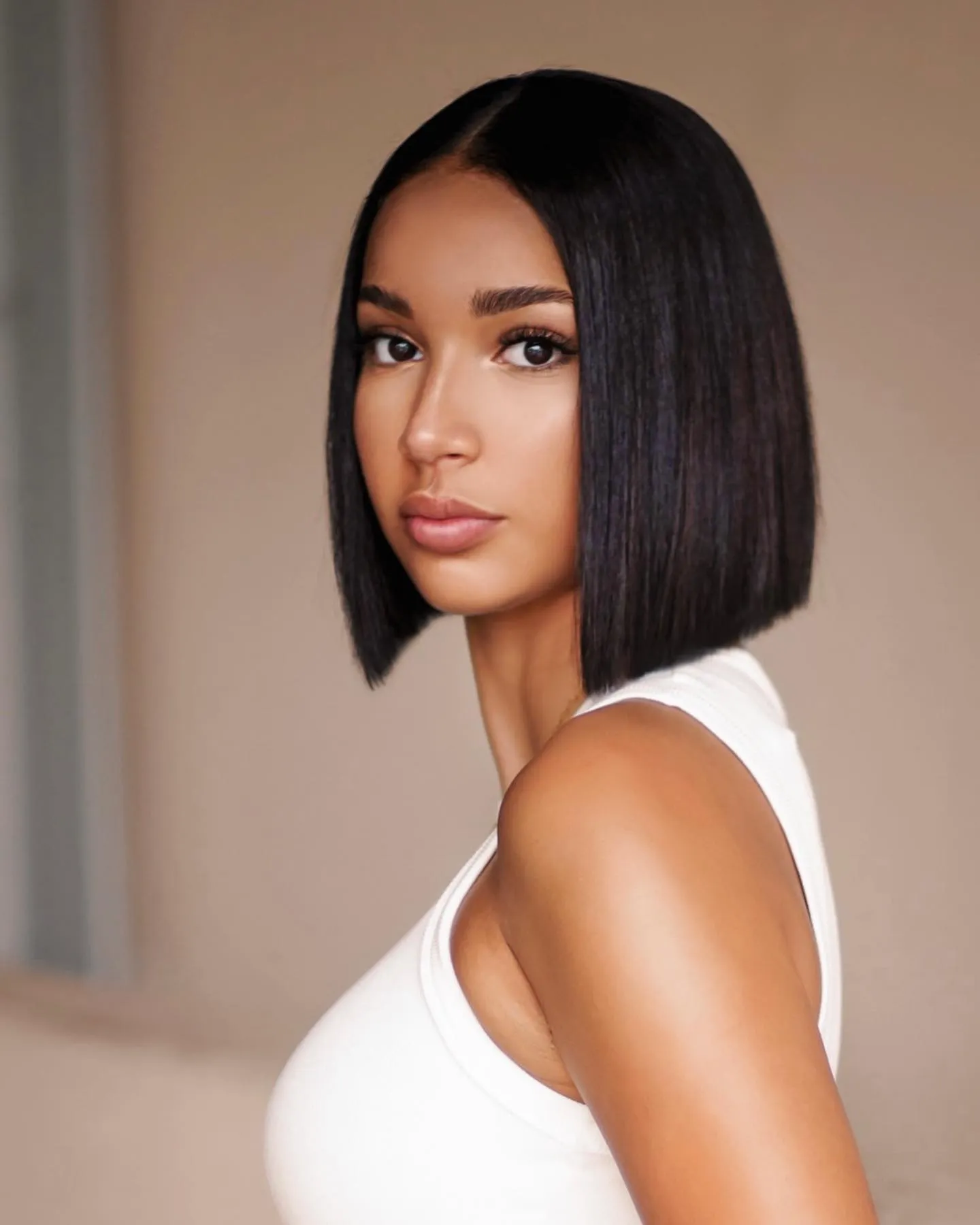 Sleek black angled bob cut near the jawline
