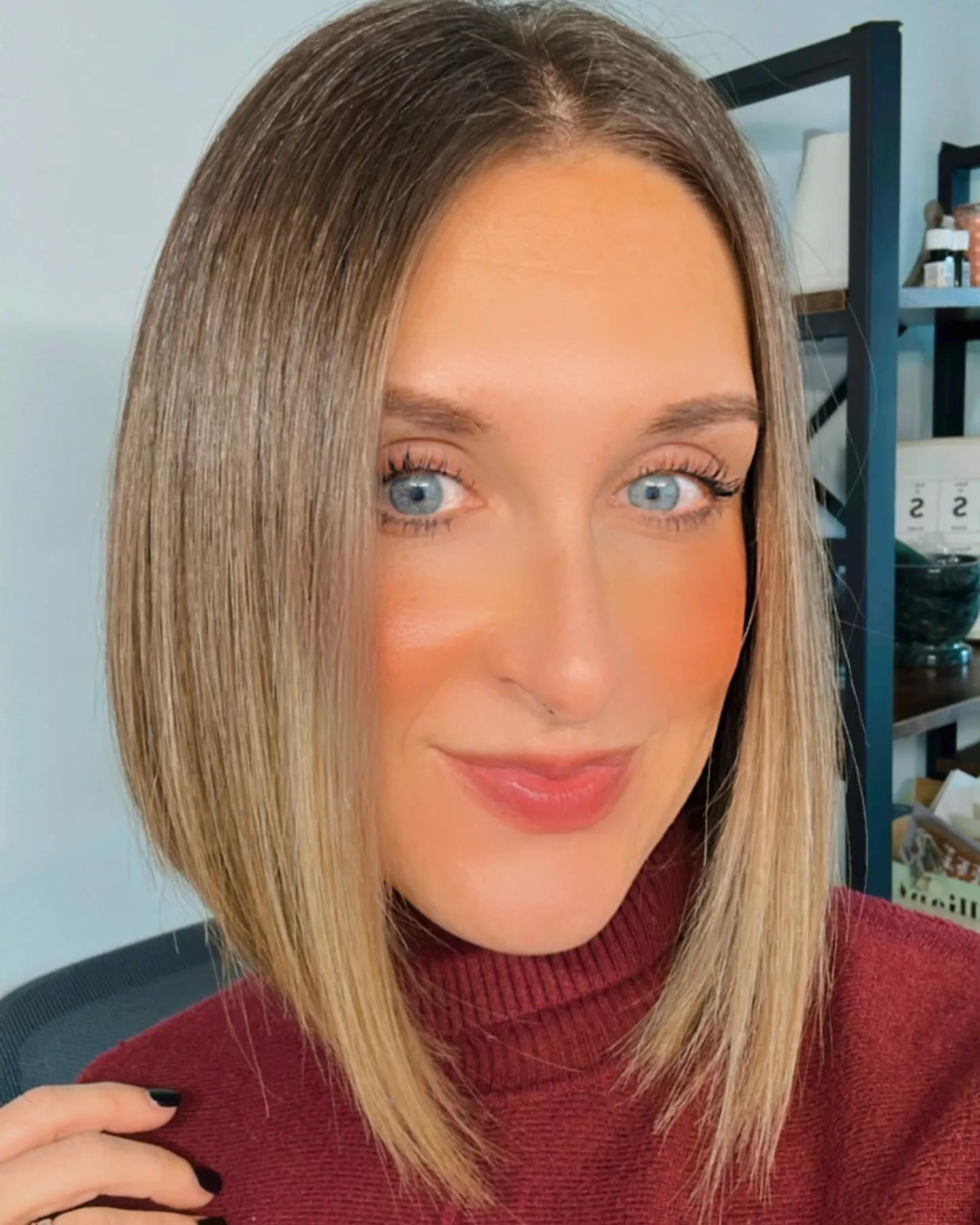 Centre-part blonde angled lob with longer front pieces