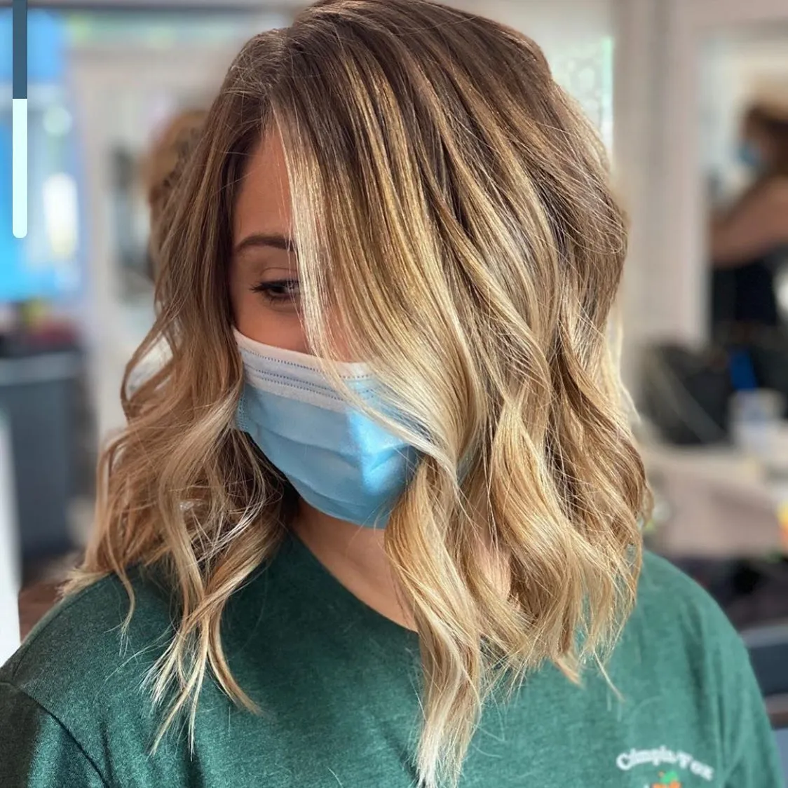Wavy blonde angled lob with textured ends
