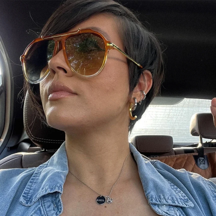 Sleek dark bixie with a long side-swept fringe