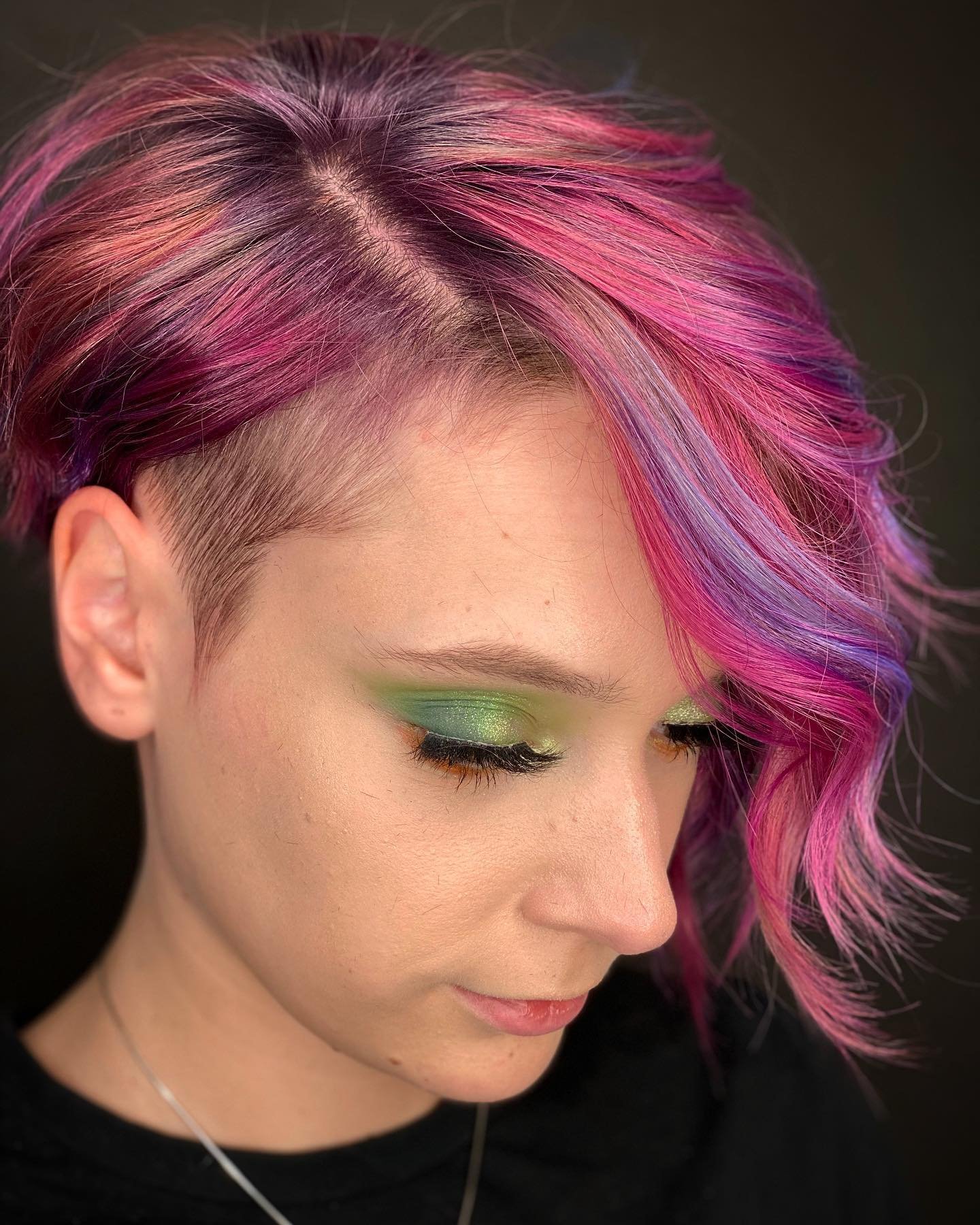 Pink wavy asymmetrical bixie with a shaved side
