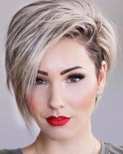 Platinum asymmetrical bixie with an extra-long fringe