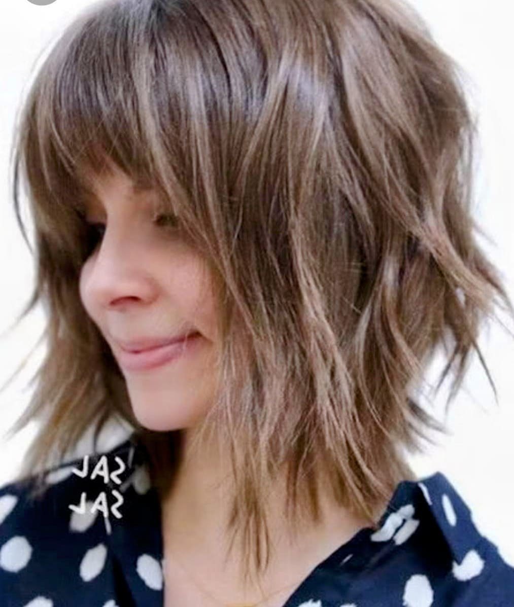 Tousled layered bixie with a full fringe
