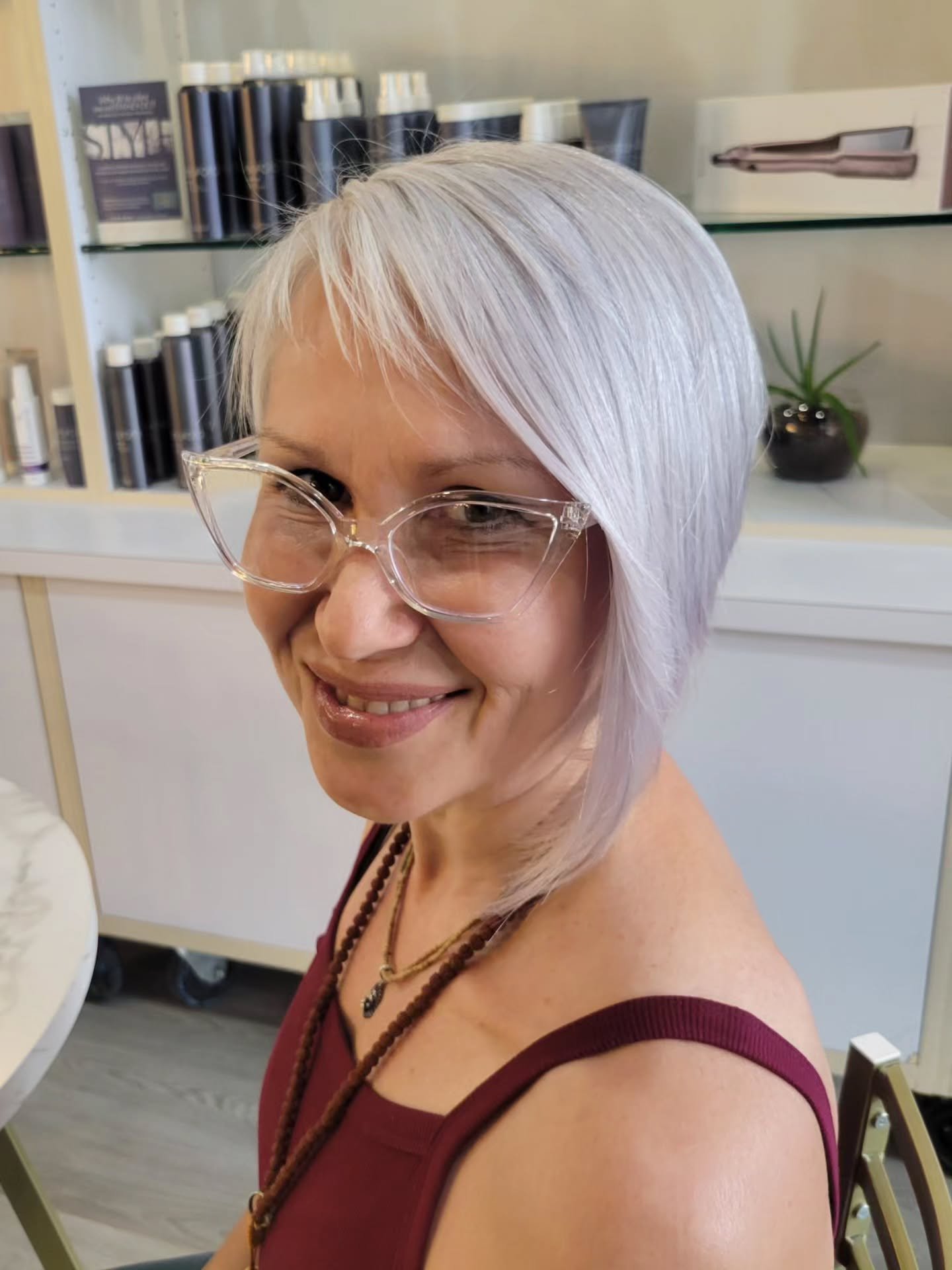 Silver bixie with a long side-swept fringe
