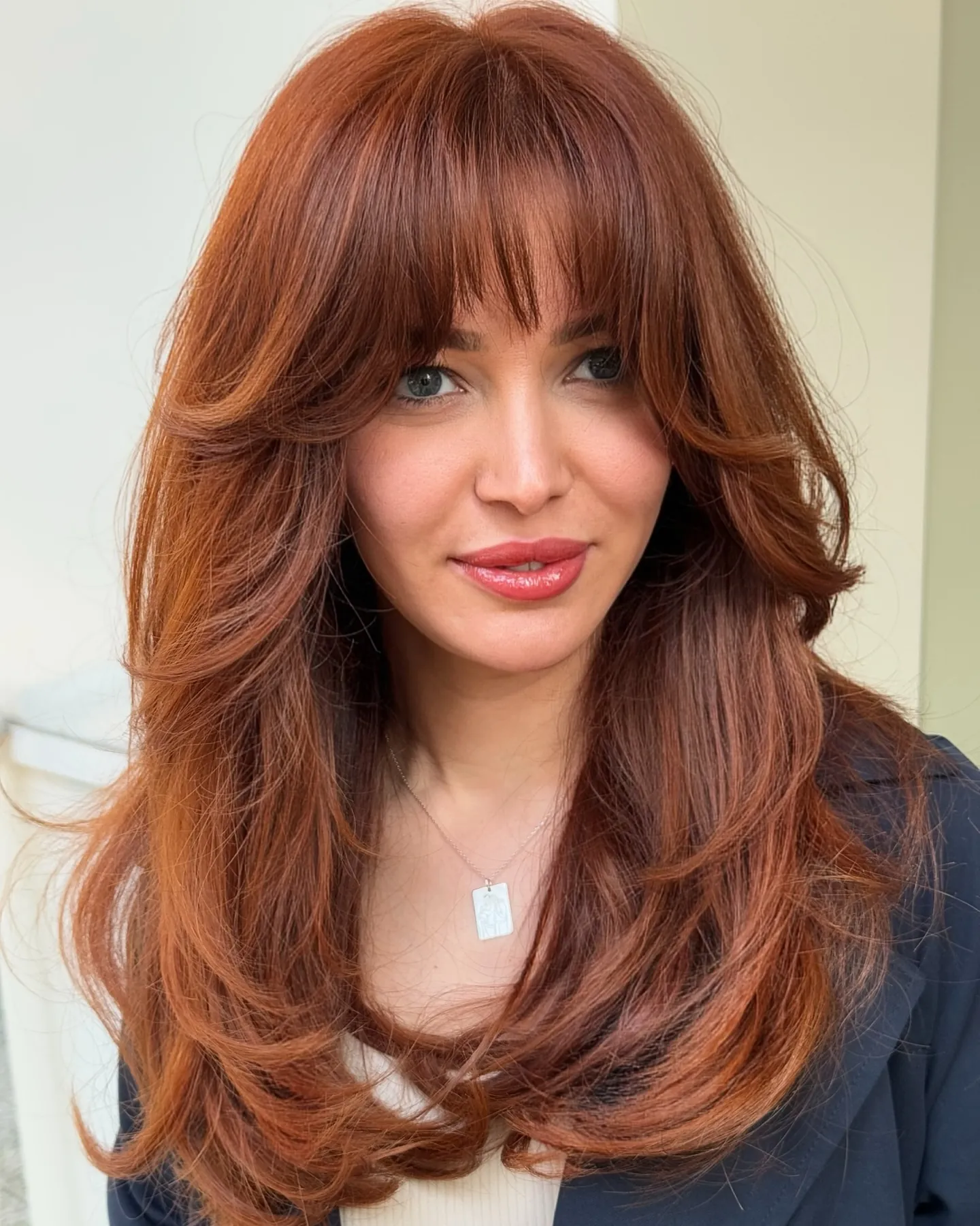 Long layered hair with curtain fringe