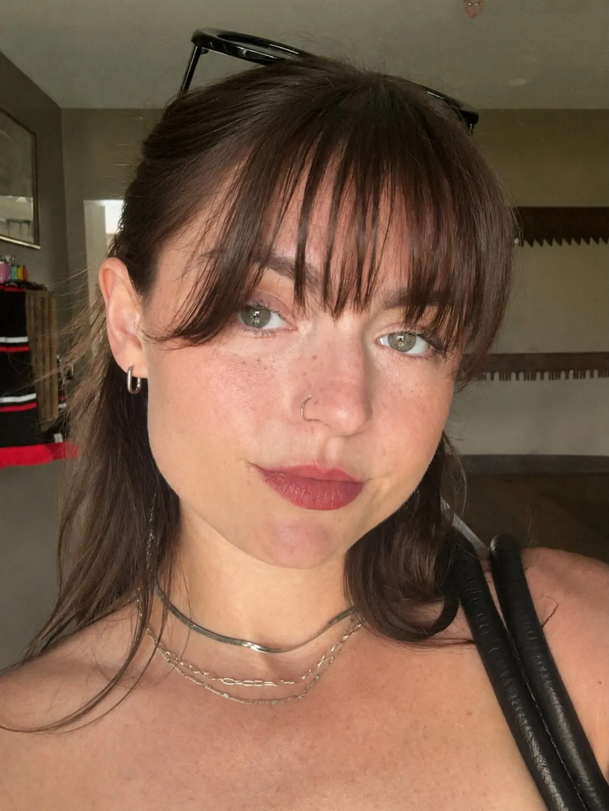 Pulled-back hair with airy curtain bangs