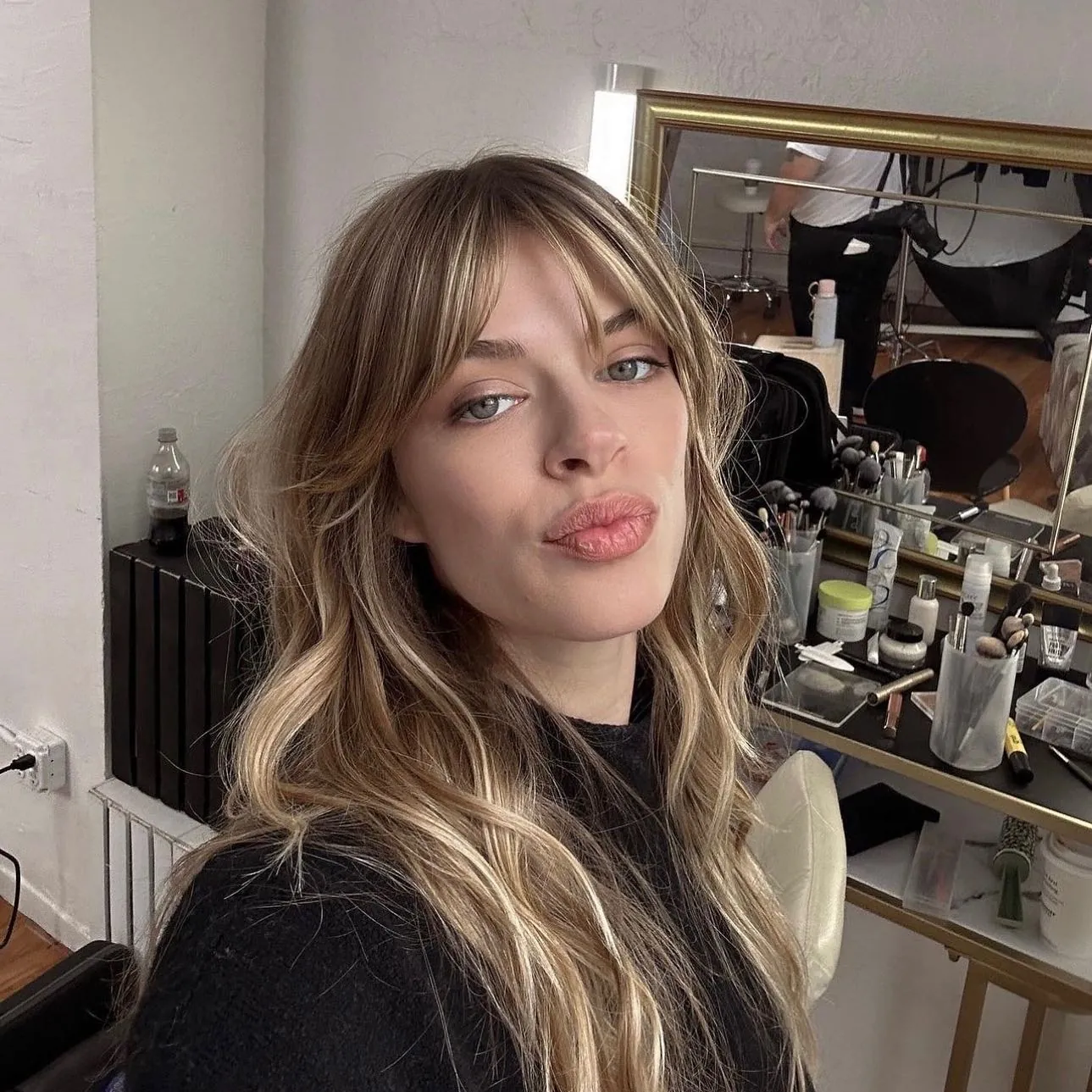 Long blonde waves with wispy curtain fringe