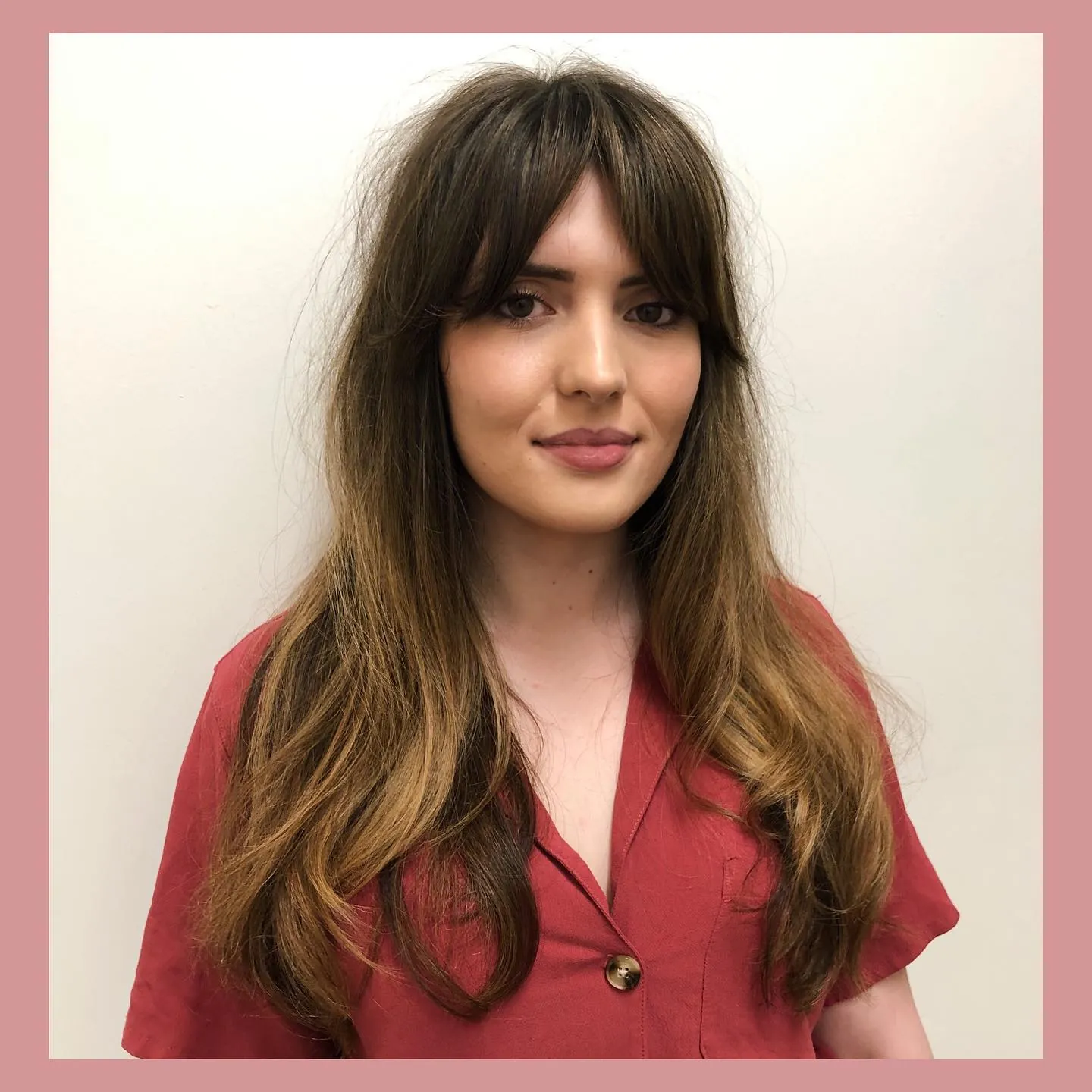 Long brunette layers with curtain bangs