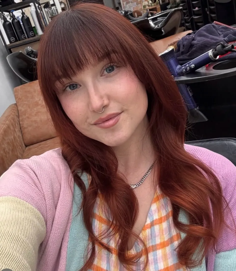 Long red waves with rounded full bangs