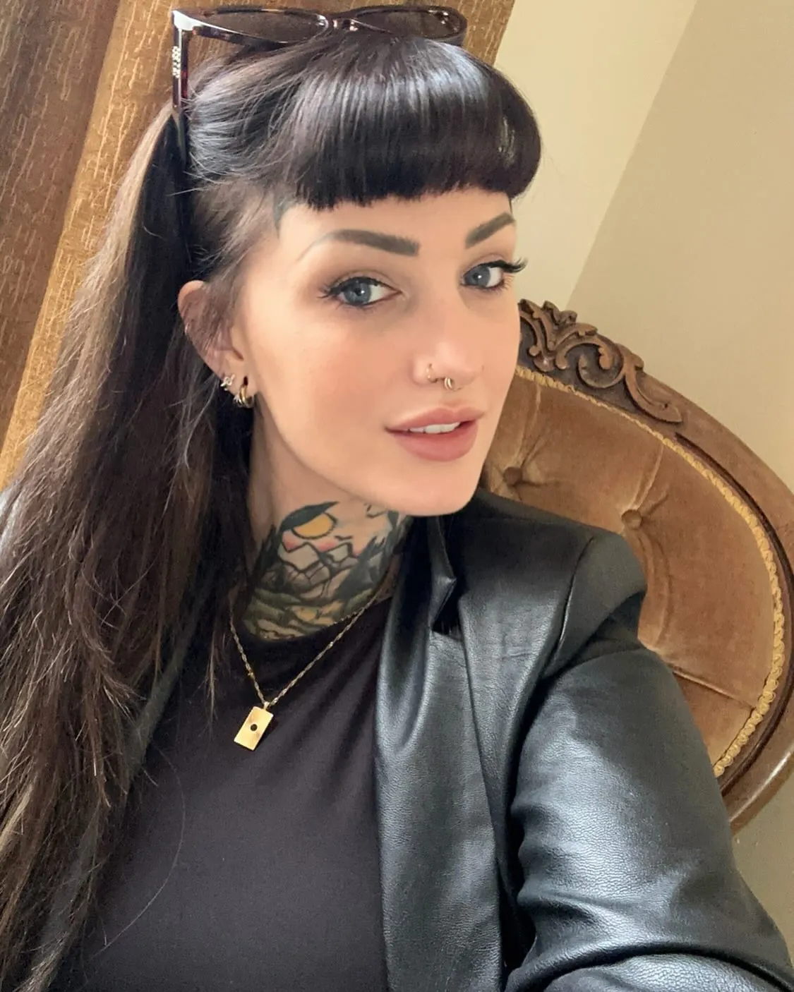 Dark ponytail with blunt micro bangs