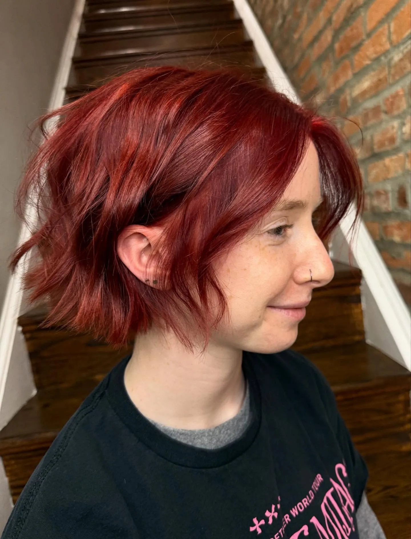 Choppy copper bob with tousled ends and side fringe