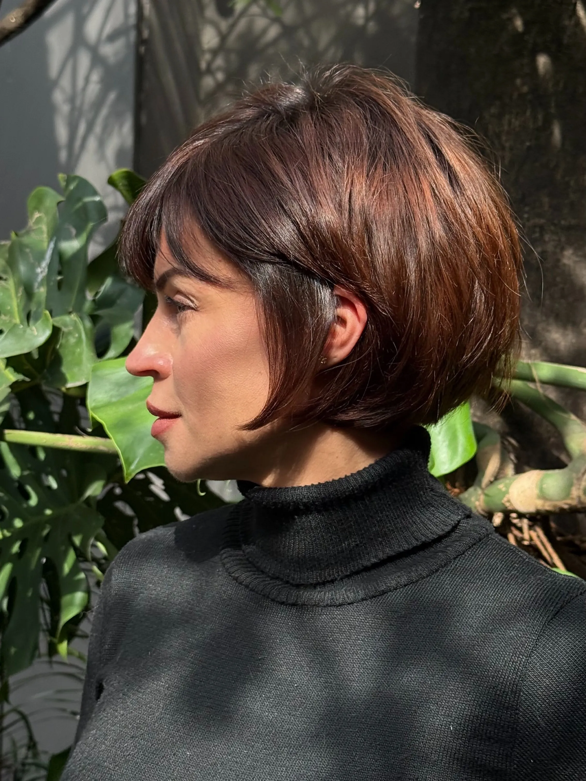 Rounded short brunette pixie bob with side fringe