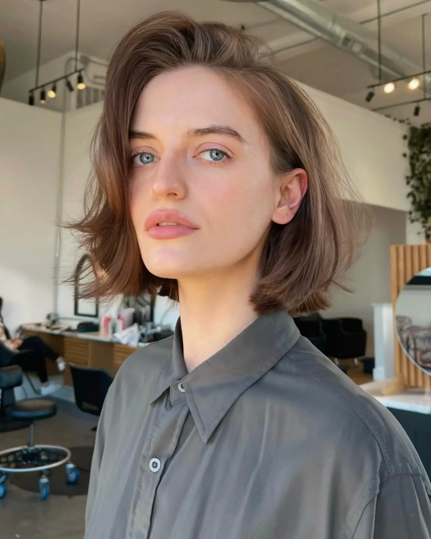 Smooth brunette bob with lifted side part