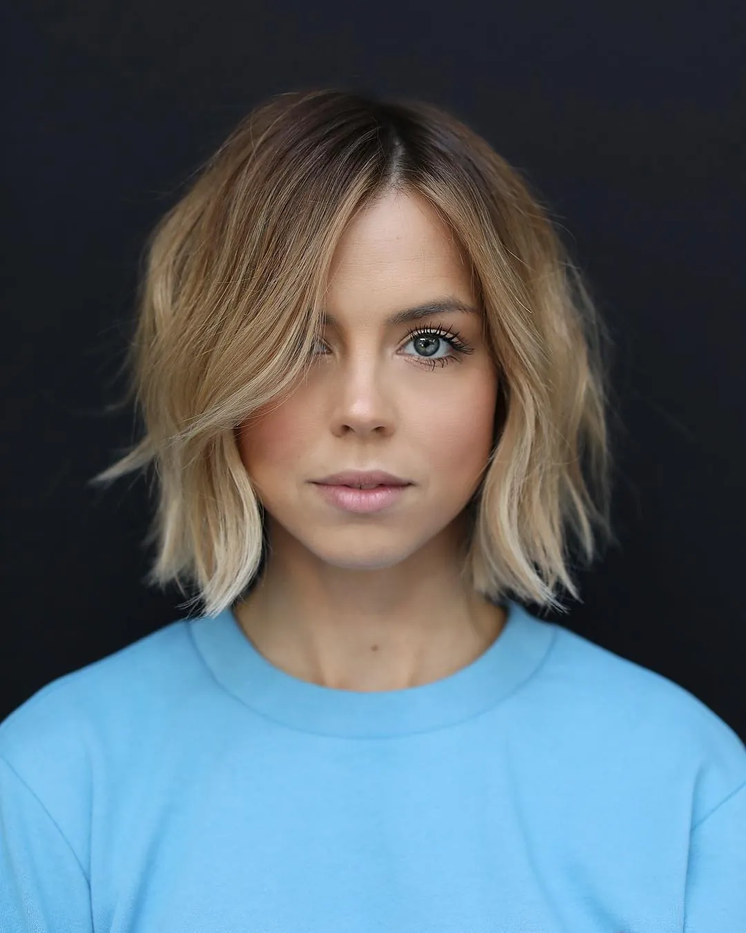 Blonde jaw-length bob with soft loose waves
