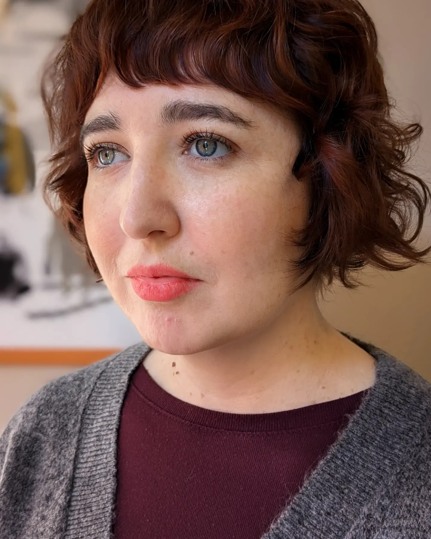 Short curly brunette bob with cropped fringe