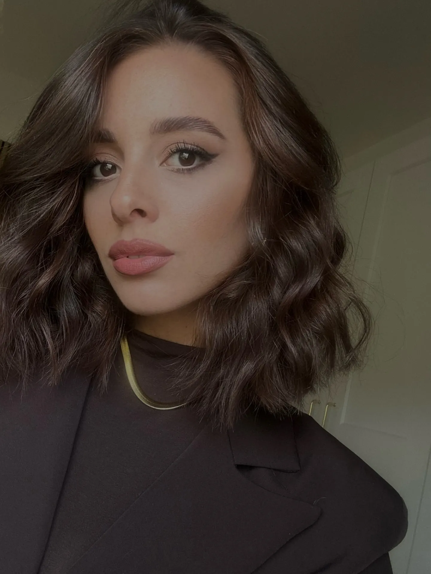 Dark brunette bob with large side-parted waves