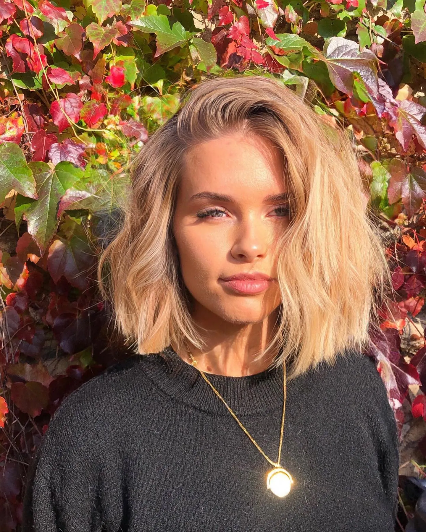 Tousled blonde bob with a loose side part