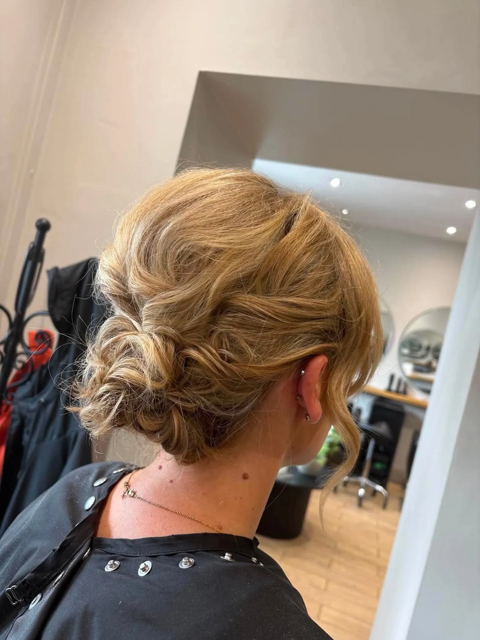 Tousled low bun with loose texture