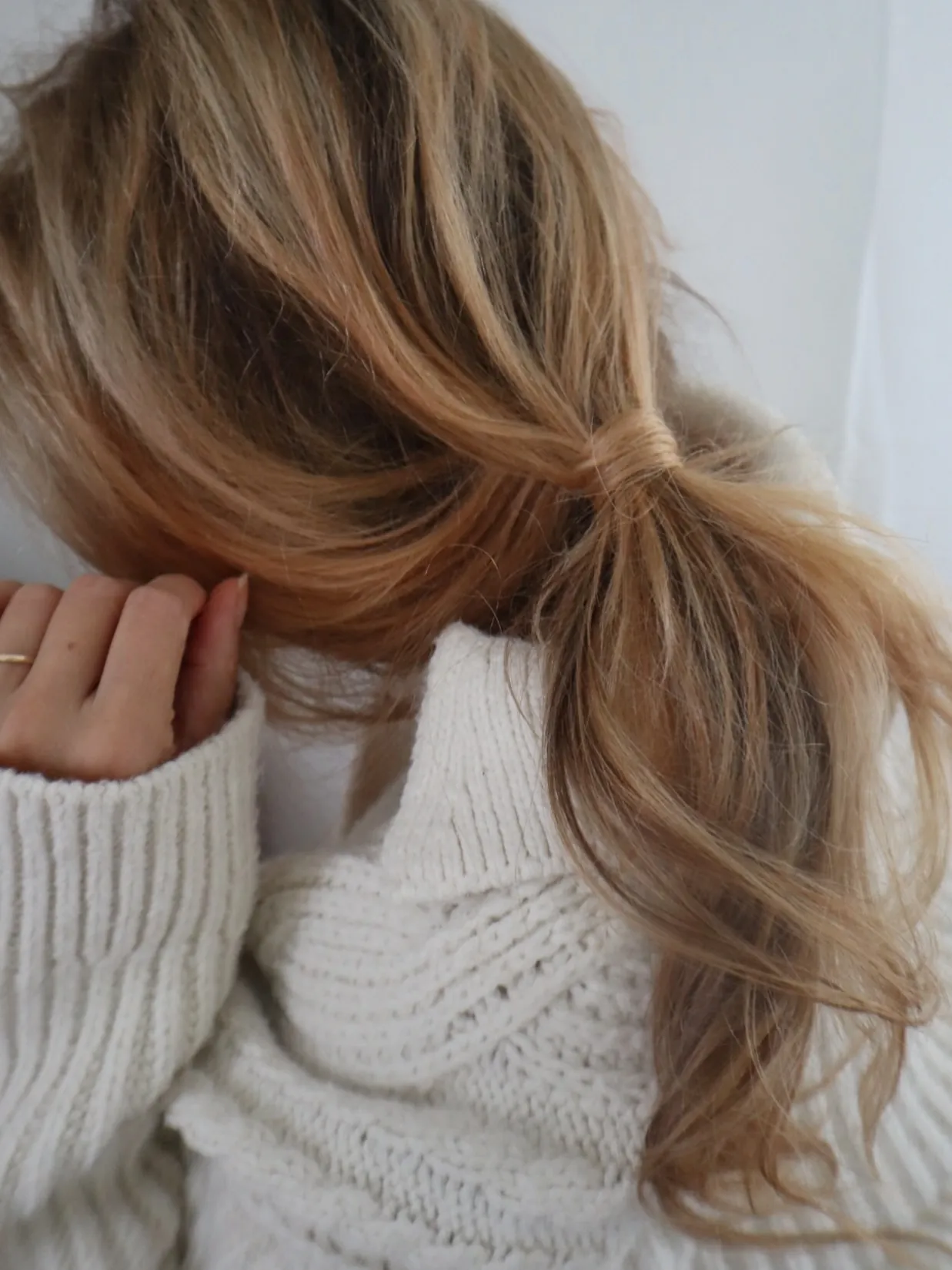 Loose low ponytail with soft blonde waves